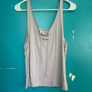 American Eagle lilac tank top with lace up.
